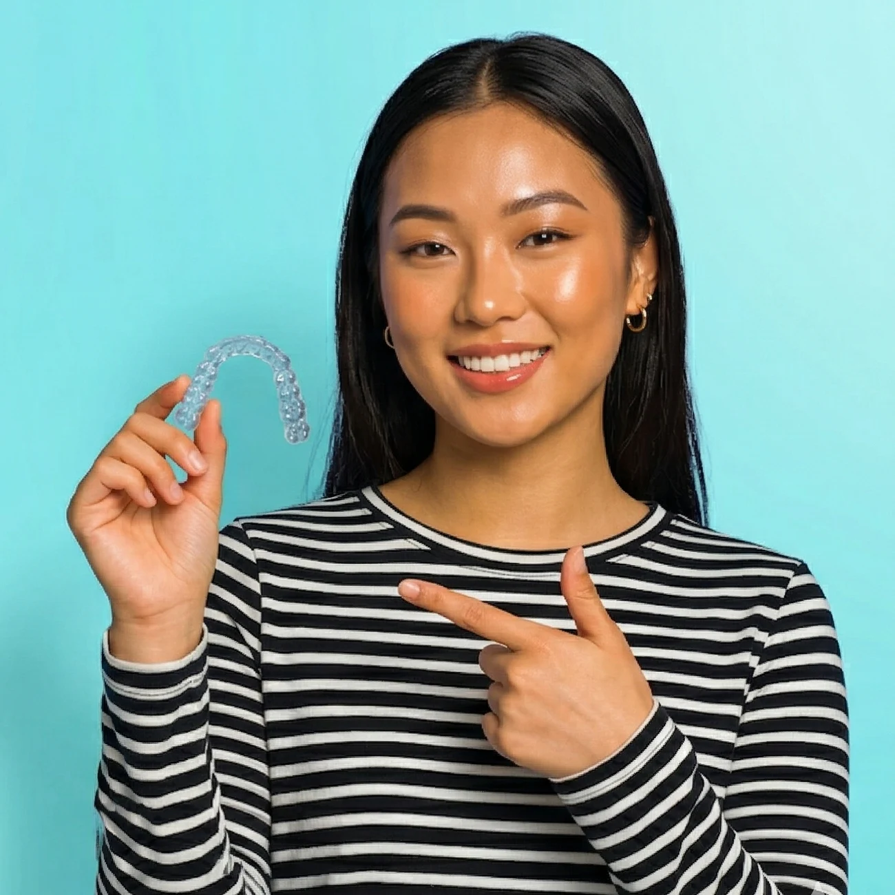 Happy patient smiling after completing clear aligner treatment