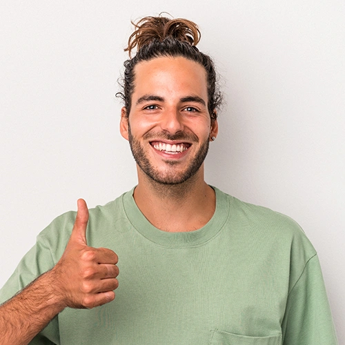 A young man giving thumbs up
