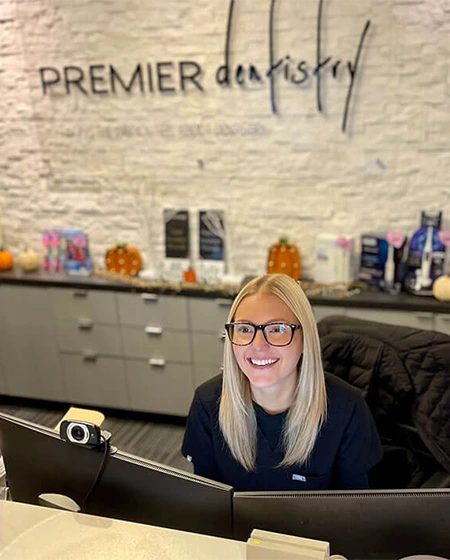 Friendly Receptionist Smiling at the Patient