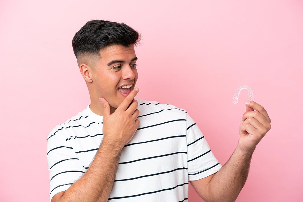 An adult surprised by Invisalign
